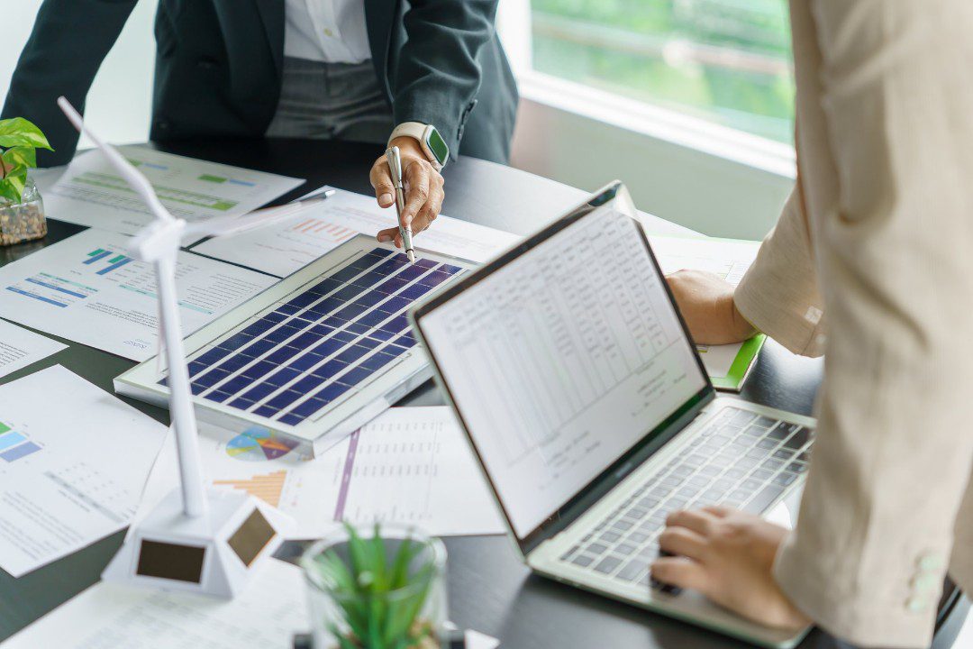 Business meeting discussing financing options for commercial solar system