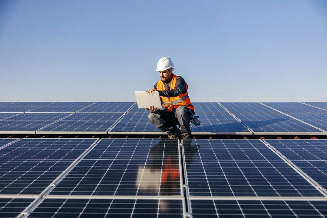 Technician performing commercial solar system maintenance