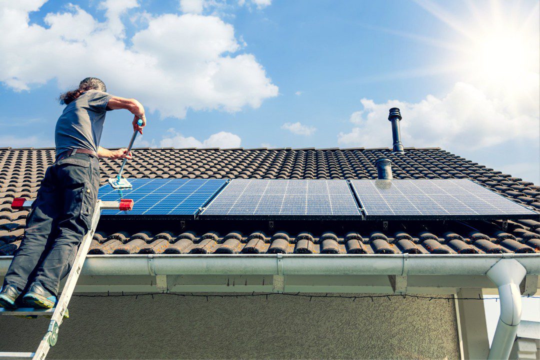 Technician doing solar system maintenance for protection plan